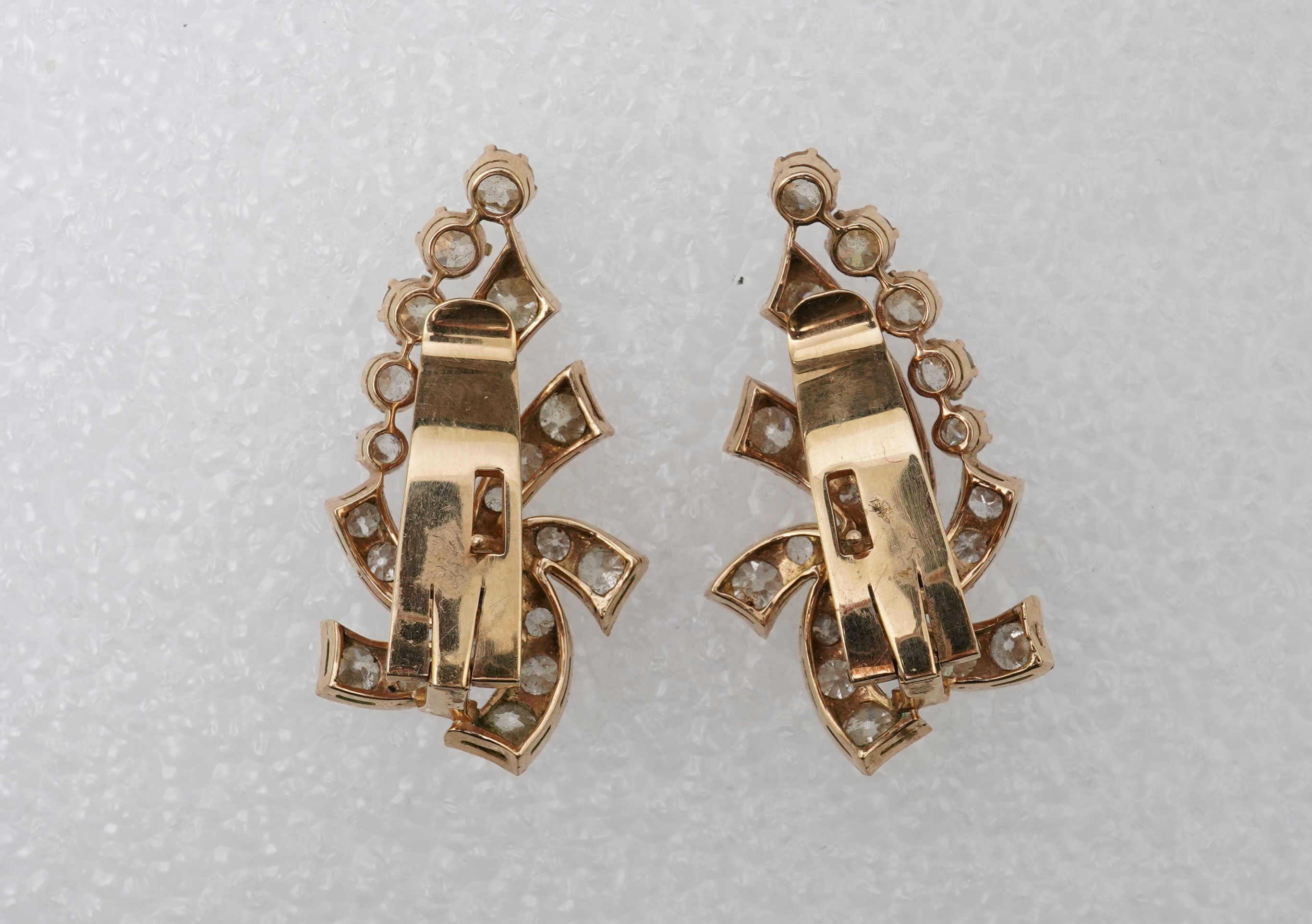 A pair of diamond ear clips, mid 20th century